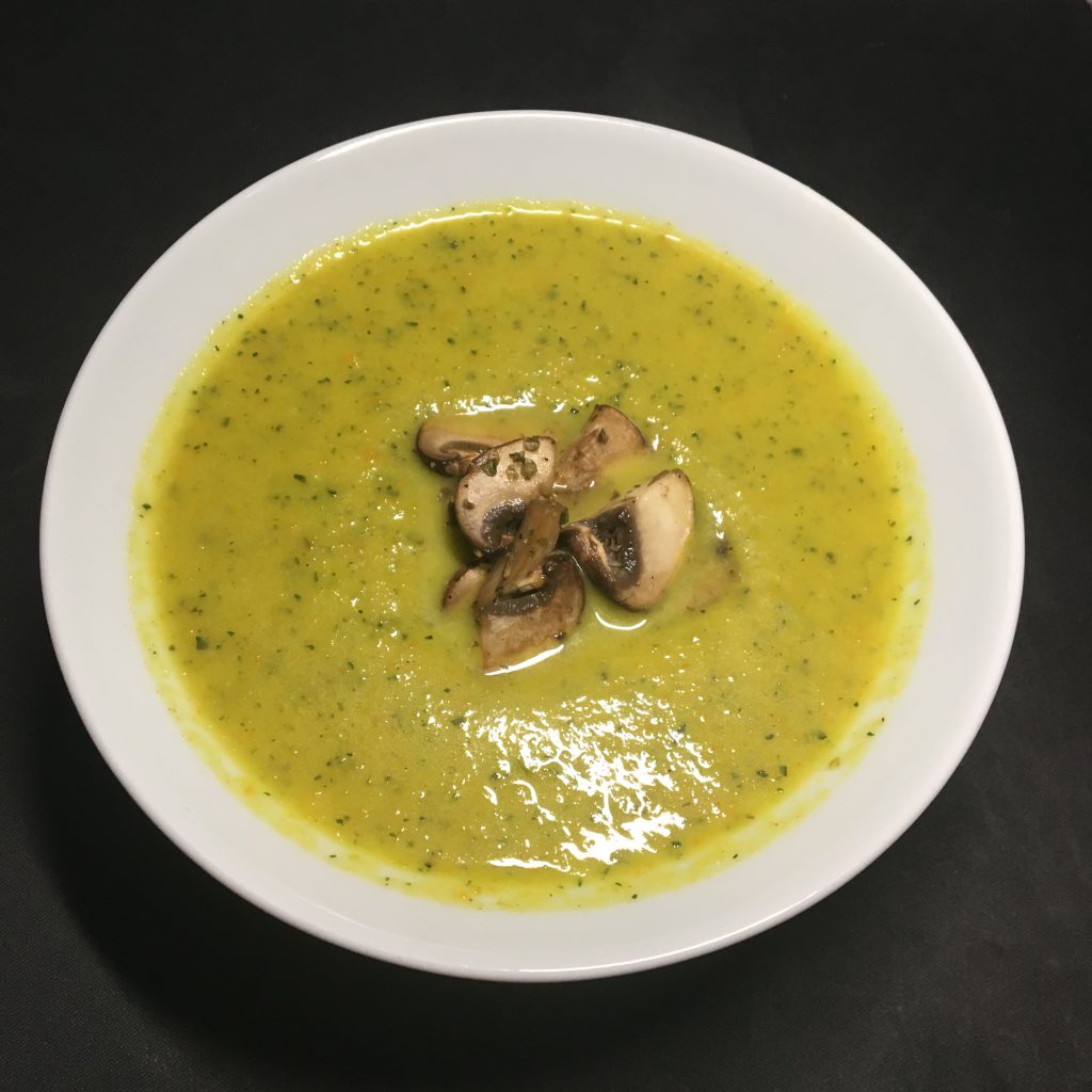 Zucchini soup with mushroom topping